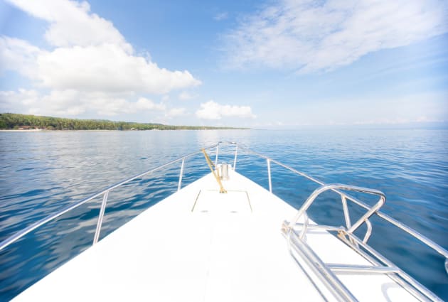 The bow of a boat heading out to open water