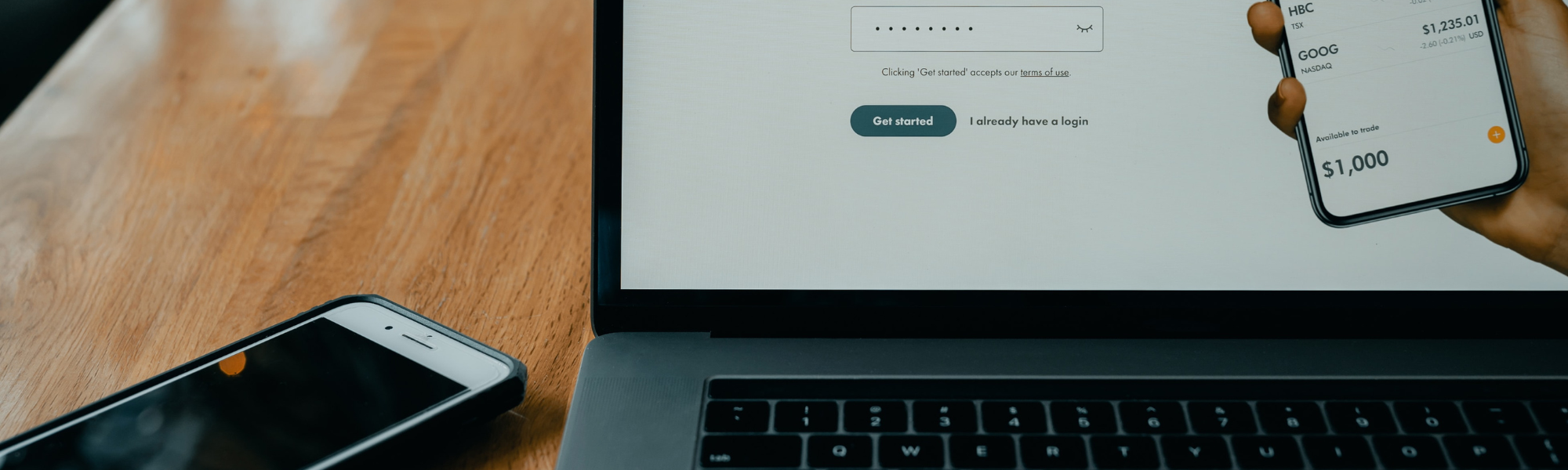 A laptop showing an Open Banking consent screen alongside a phone displaying a bank balance