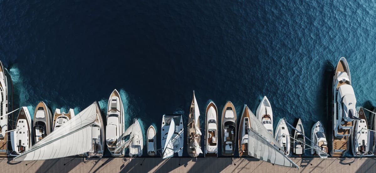 A marina full of boats at sunset