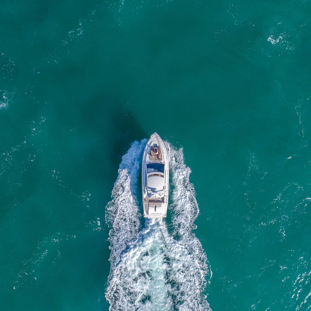 Aerial view of a boat on calm turquoise water