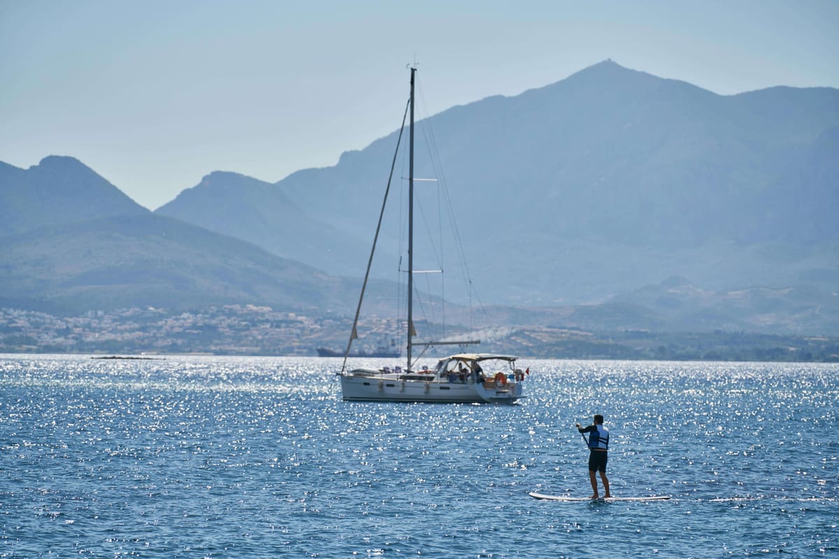 A yacht at anchor in calm water